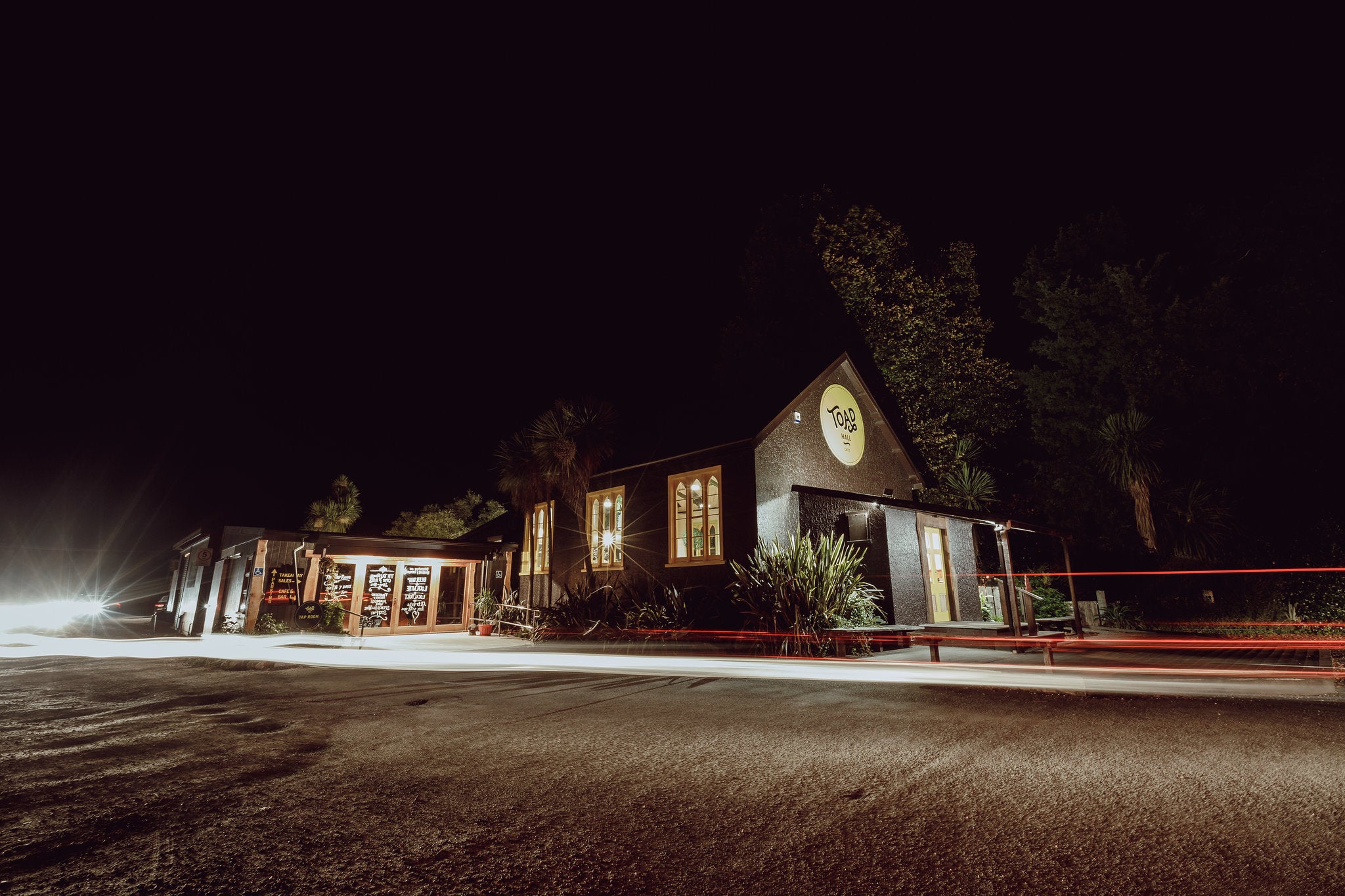 The historic Toad Hall building illuminated at night